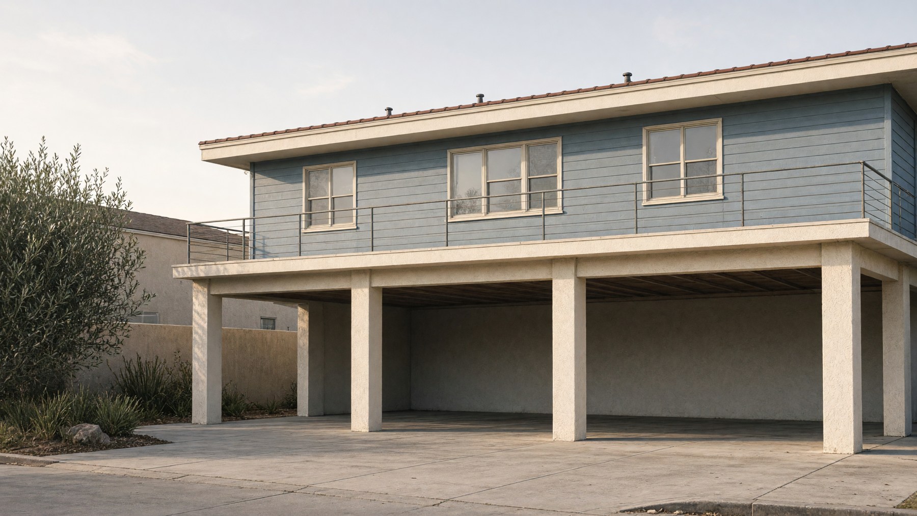 AI-generated editorial illustration of a lowrise apartment wing supported above an empty carport.